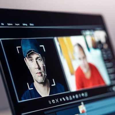 Deep fake, AI and face swap in video edit. Deepfake and machine learning. Facial tracking, detection and recognition technology. Digital identity interchange. Computer software mockup.